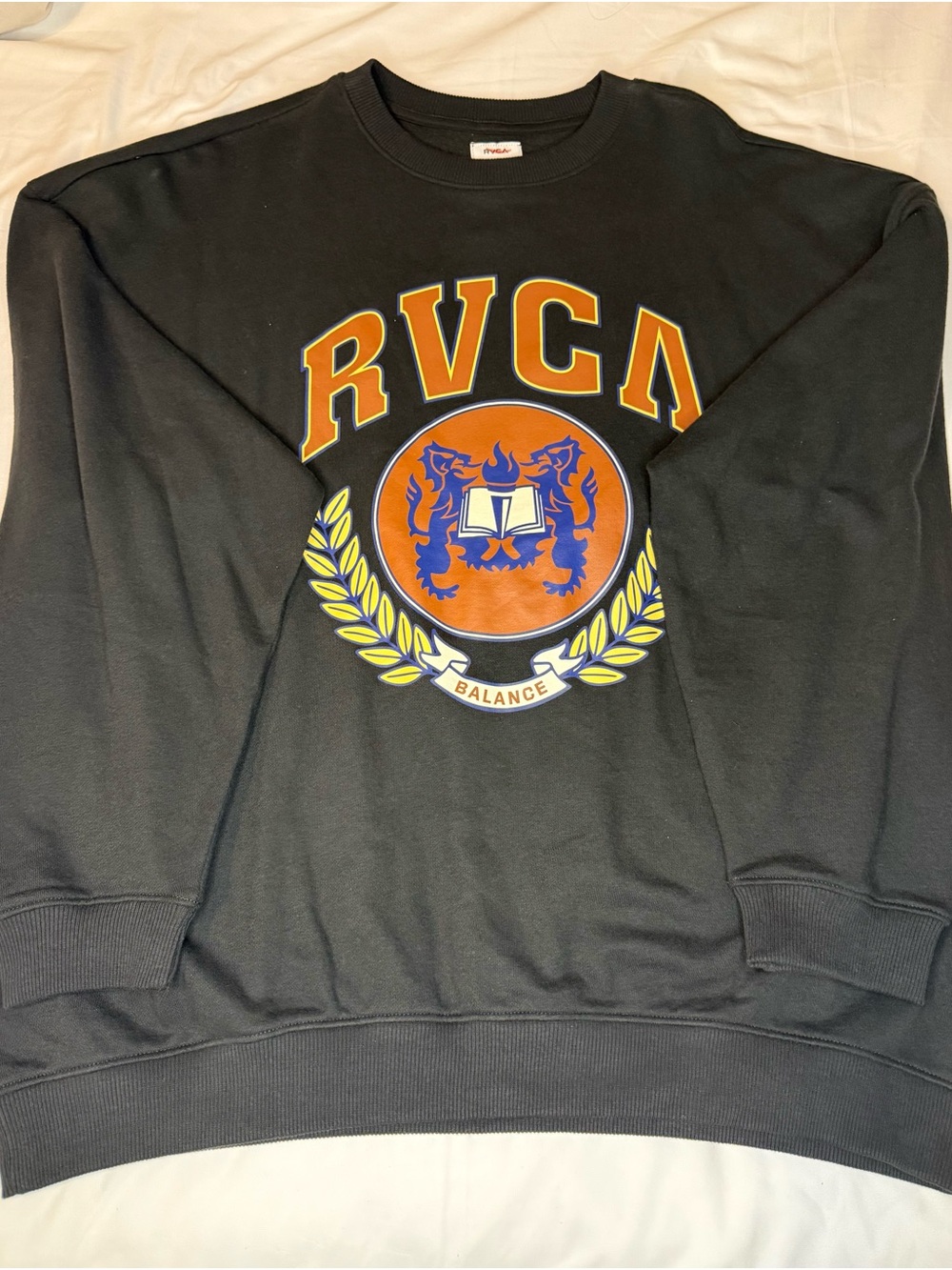 RVCA Black Crewneck Sweatshirt with Orange and Yellow Crest